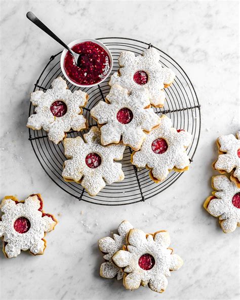 Linzer Christmas Cookies With Powdered Sugar And Raspberry Jam From
