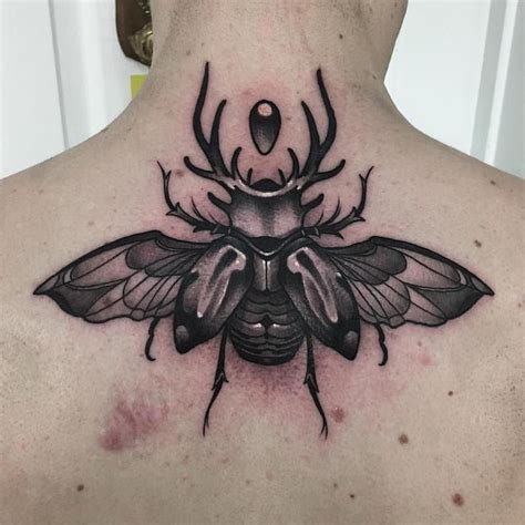 25 Of The Best Unique Beetle Tattoos Tattoo Insider Throat Tattoo
