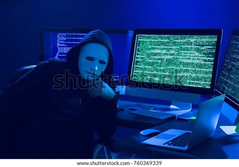 Hacker Mask Using Computer Dark Room Stock Photo Edit Now 760369339