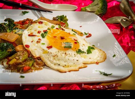 Canned Chinese Food Chop Suey With Fried Sunny Side Up Egg Stock Photo