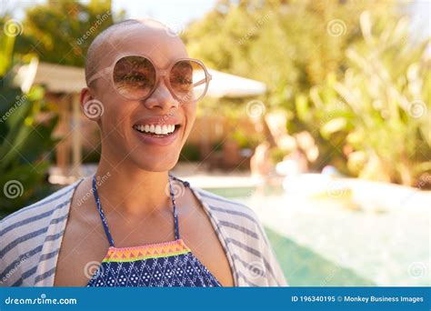 Portrait Of African American Woman With Shaved Head Outdoors With