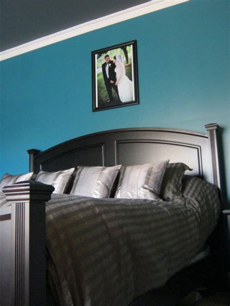 Tall glass lamps complement the headboard and ceiling height. dark teal bedroom - Google Search | Teal bedroom, Teal ...