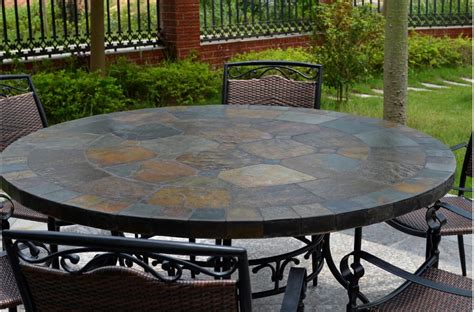 It has a rating of 4.8 with 33 reviews. 63'' Round Slate Outdoor Patio Dining Table Stone OCEANE