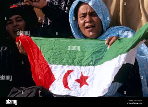 A Woman Holding The Western Sahara Flag During The Sahrawi Independence