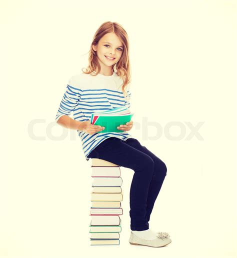 Little Student Girl Sitting On Stack Of Books Stock Image Colourbox