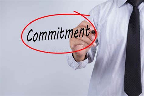 Businessman Hand Writing Commitment With A Marker Over Transparent