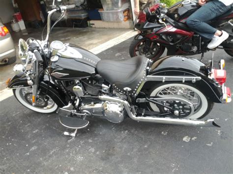 With brilliant white wall tires, laced wheels, and leather saddle bags and seat, the heritage. 2011 harley davidson heritage softail classic "custom"
