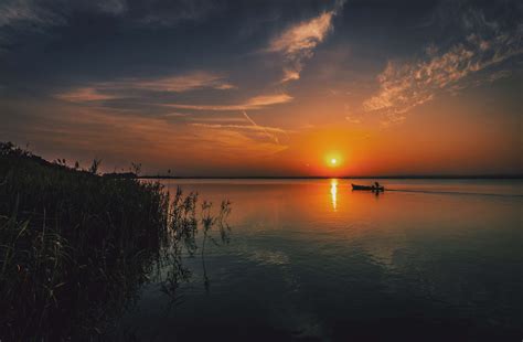 1080x1920 1080x1920 Boat Evening Lake Sunset Silhouette
