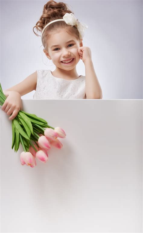 Little Girl Holding Flowers Stock Photo Free Download