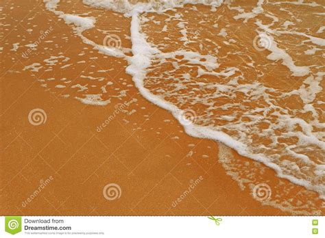 Sea Beach Sand With Foamy Wave A Lot Of Space For Text Stock Photo