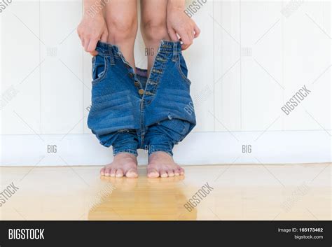Women Remove Jeanslie Down On Image And Photo Bigstock