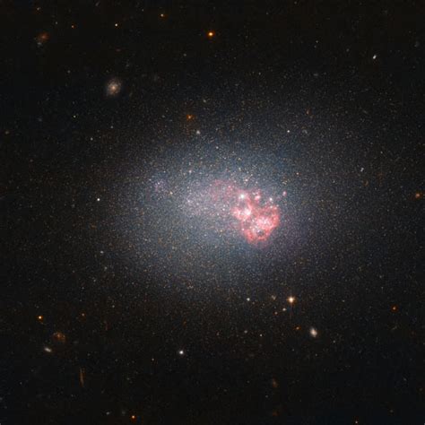 Hubble Displays Blue Compact Dwarf Galaxy Greenareame
