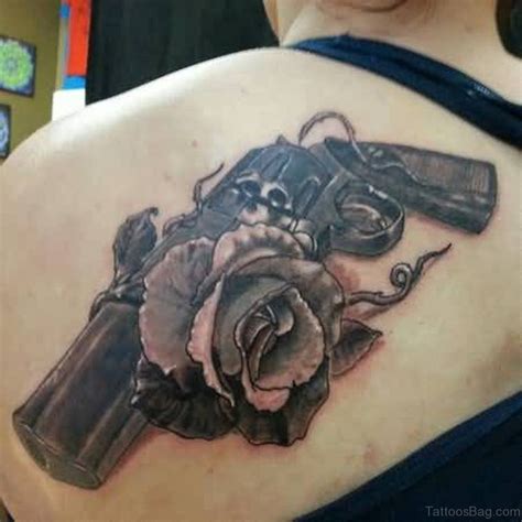 This tiny version of rose tattoo is surely going to raise a lot of eyebrows. 64 Ultra Modern Gun Tattoos For Back