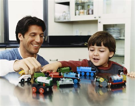 All images must be direct linked. father and son playing with trains - CK Public Health