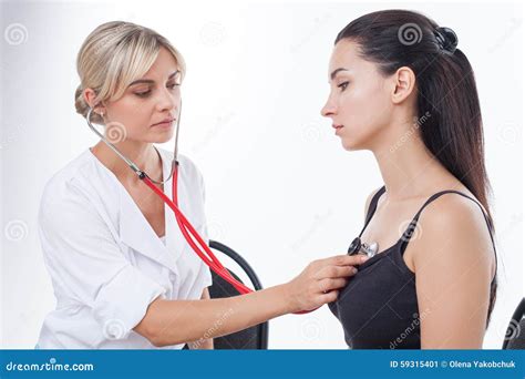 Beautiful Young Physician Is Seeing Her Patient Stock Photo Image