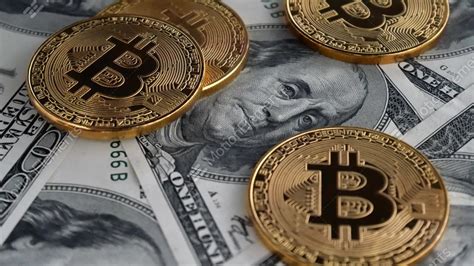 1 bitcoin = 34,009.42 usd. Gold Bitcoin BTC Coins Rotating On Bills Of 100 Dollars ...