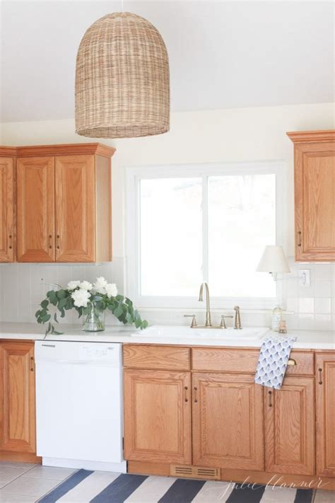 .cabinets ,painted kitchen doors ,kitchen cabinet finishes ,refinishing oak cabinets ,red kitchen cabinets ,hardwood kitchen cabinets ,repaint kitchen. Updating a Kitchen with Oak Cabinets {Without Painting Them}