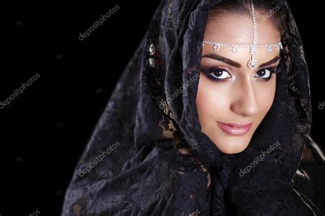 Beautiful Woman In Middle Eastern Niqab Veil On Isolated Black B