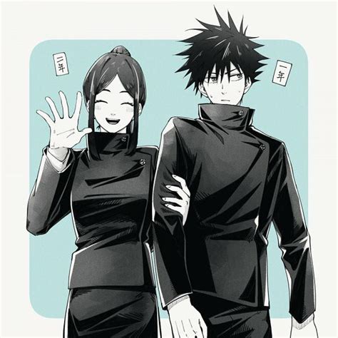 Two People Dressed In Black Standing Next To Each Other With Their