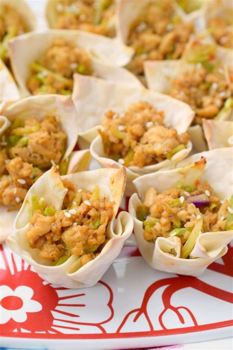 Working with 1 wonton wrapper at a time (cover the remaining wrappers to keep from drying), spoon about 2 teaspoons chicken mixture into center of wrapper. Asian Chicken Wonton Cups - Snacks and Sips
