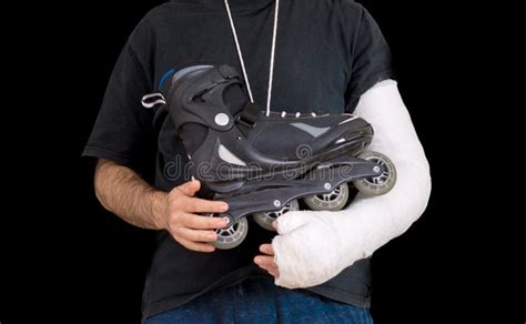 Young Man Wearing An Arm Cast After A Skating Accident Stock Image