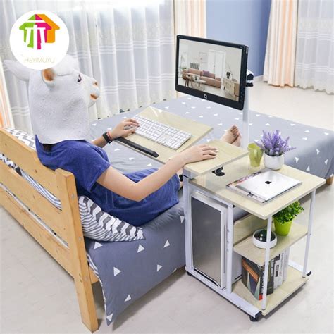 Besides work tasks, lap desks are also handy for leisure purposes. Simple bedside lazy small computer desk bed computer desk ...