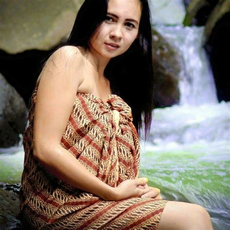Woman In Batik Dress By The River