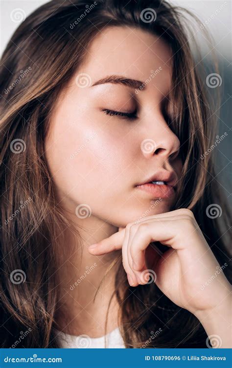 Close Up Portrait Of Beautiful Woman With Closed Eyes Stock Photo