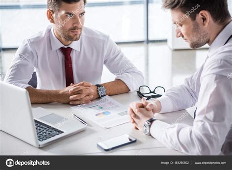 Businessmen Discussing Charts — Stock Photo © Dmitrypoch 151250502