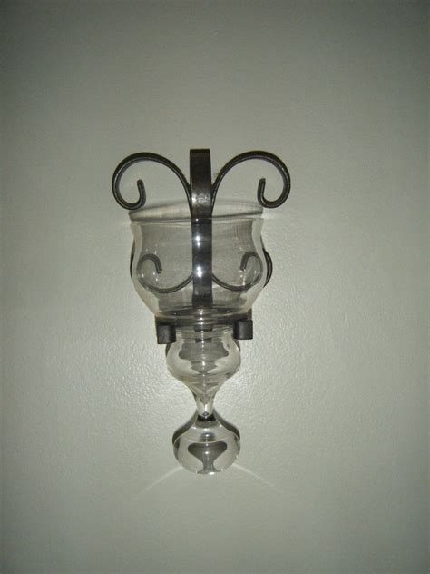 This sconce is wonderfully designed using old world blacksmithing tools and techniques. Unique wrought iron and glass wall candle holder/sconce ...