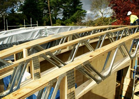 However, if the timber is slightly curved, the curve should be facing downward so that the curve is flattened out the timber should be cut based on the size of the roof and specifications in the design. Trusses for Curved Timber Roof Prefabrication by MiTek