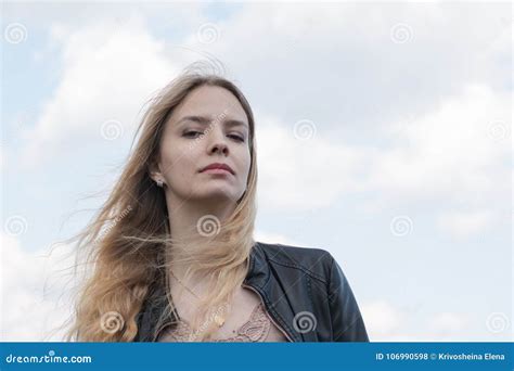 Girl With Blond Hair And Blue Sky And White Cloud Stock Photo Image
