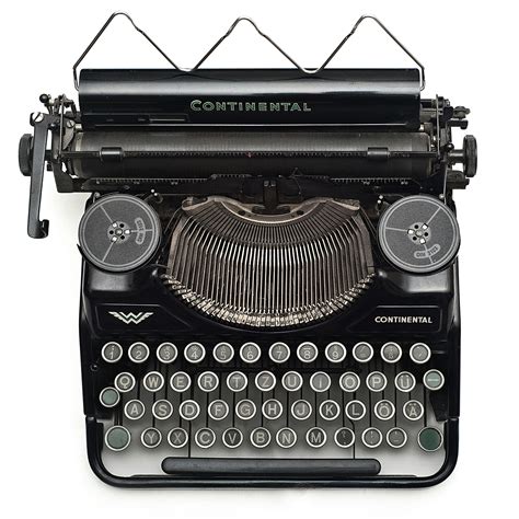 Black Continental Typewriter On White Surface · Free Stock Photo