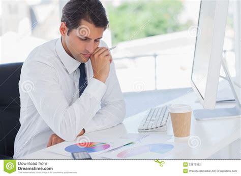 Concentrated Businessman Analyzing Graphs Stock Photo - Image: 32879362