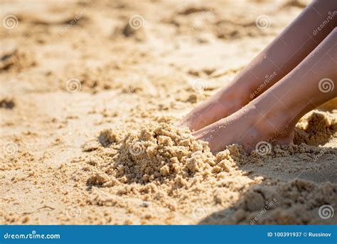 Picture Of Female Feet Buried In Sand At The Beach Royalty Free Stock