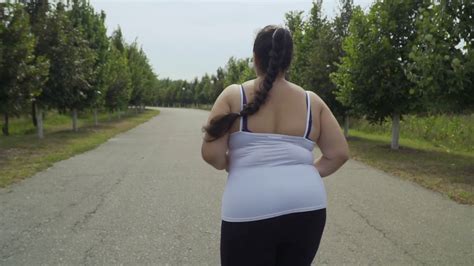 Fat Girl Runs Along The Road Stock Video Footage 0019 Sbv 327457917 Storyblocks