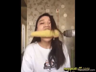 Asian Girl Eating Corn On The Cob Using Power Drill Loses Hair On Make A Gif