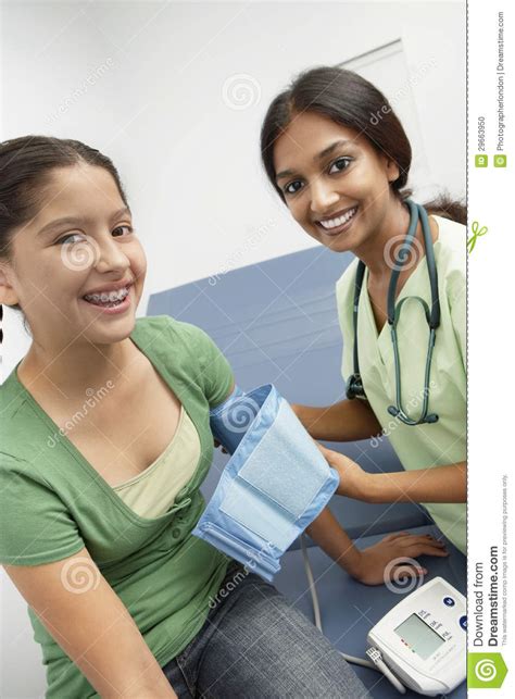 Female Doctor Taking Girl S Blood Pressure Stock Photo Image Of