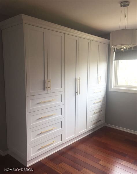 White Closet Wardrobe With Brass Hardware— Home Joy Design Build A