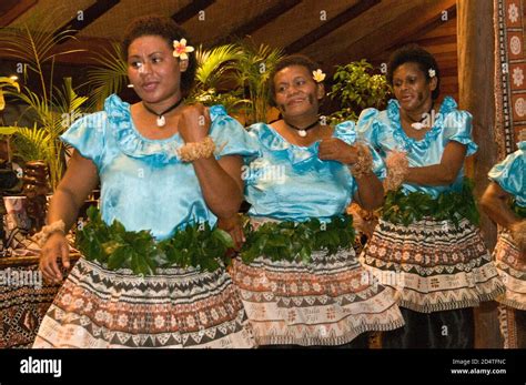 A Group Of Fijians In National Dress Giving An Evening Performance