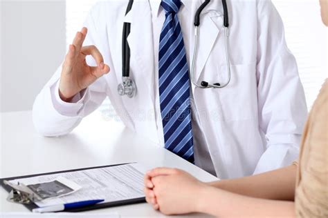 Close Up Of A Doctor Man Hands Showing Ok Sign While Consulting Patient Stock Image Image Of