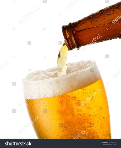 Beer Pouring Into Glass On White Stock Photo Edit Now 161089394