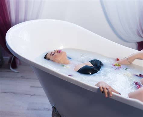Brunette Woman Relaxing In Hot Milk Bath With Flowers Stock Photo Image Of Interior Adult