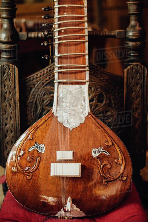 Tabla is a traditional musical instrument that originated from the indian subcontinent. Close up photo of a sitar, traditional Indian musical instrument - Stock Photo - Dissolve