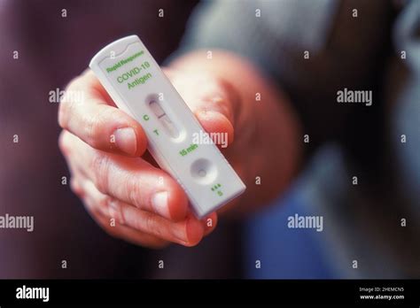Hands Of A Woman Holding A Rapid Response Covid 19 Antigen Test With A