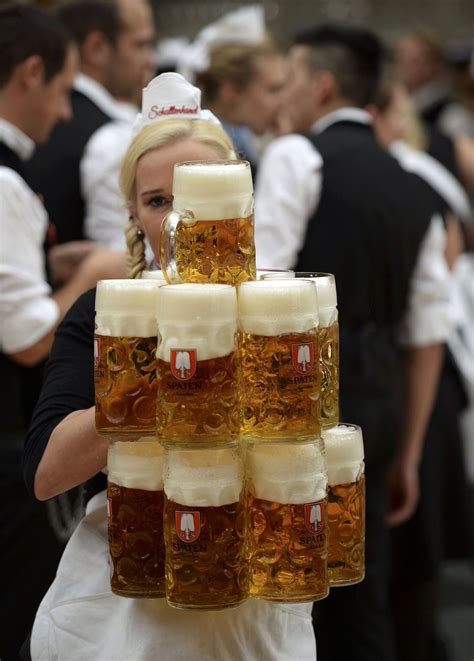 How Do They The Waiters At Oktoberfest Beer Tents Do It This Memorable Image Captures One Of