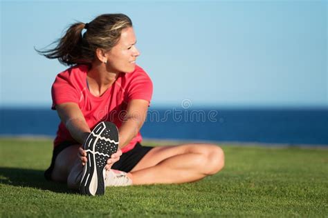 2029 Fitness Runner Woman Stretching Grass Photos Free And Royalty