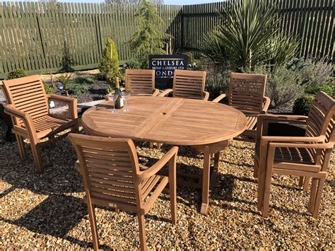 Teak Extending Table With 8 Stacking Chairs Rattan Garden Furniture