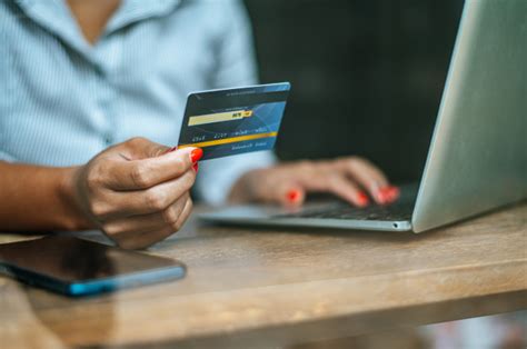 As you become aware of the bill, you can just keep the necessary funds on the account for a smooth payment. Free Photo | Woman paying online with a credit card