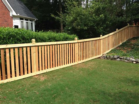 Have an ugly neighboring wall that you want to hide? Capped Picket Fences | Accent Fence